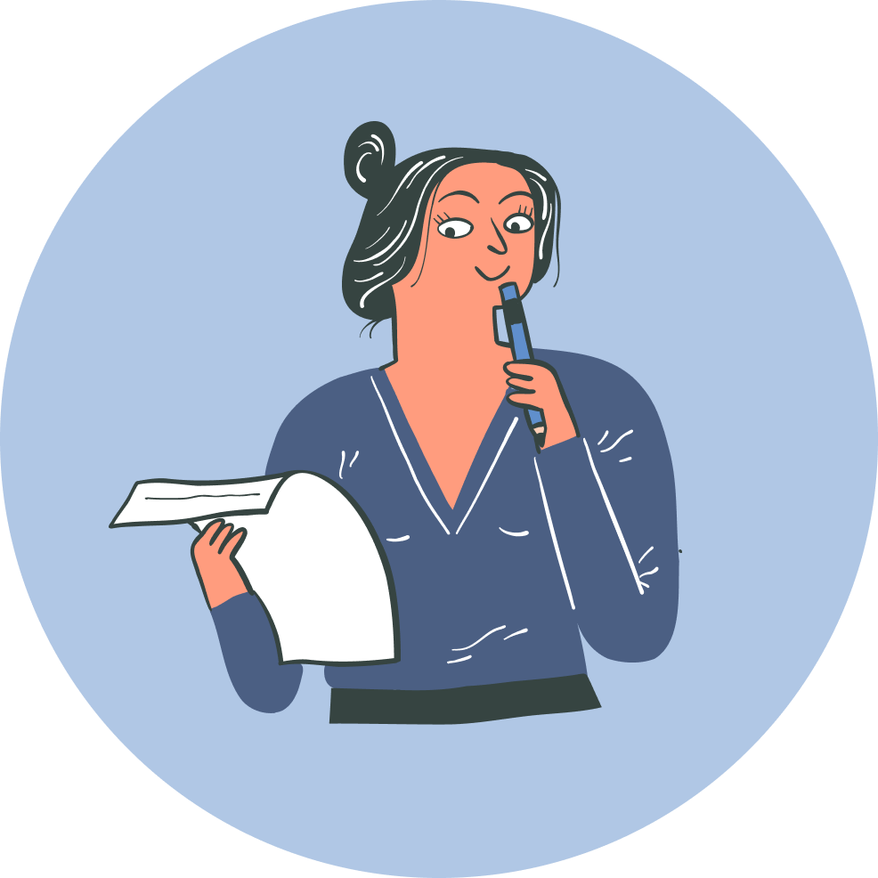 Person holding pen and looking at a piece of paper