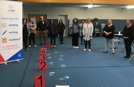 Photo of group of people participating in the 26Ten literacy awareness workshop